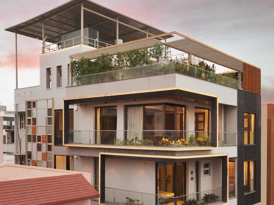 G+2 brick residential building with balconies